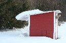 snow covered shed